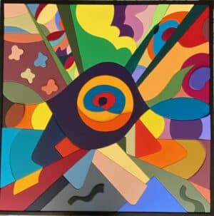 Tableau décoratif « Monde des Couleurs » en bois peint, grand format 100 × 100 cm, forme centrale évoquant un œil entourée de teintes variées.